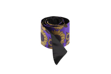 Rolled purple & black silk Mimi Fong skinny scarf with gold sunflower pattern on white background