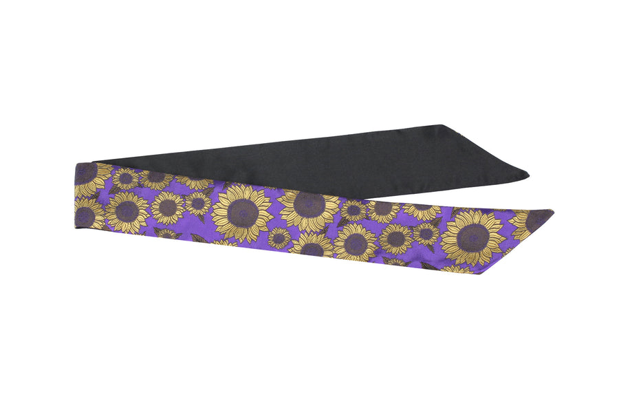 Purple & black silk Mimi Fong skinny scarf with gold sunflower pattern on white background