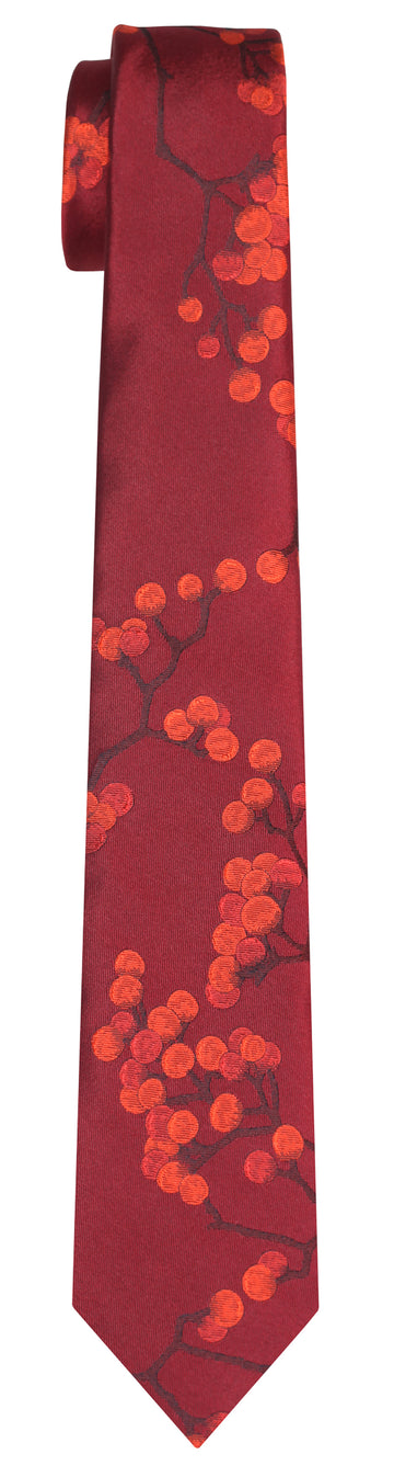 A deep red silk Mimi Fong tie with all over berries pattern in hues of orange against a white background