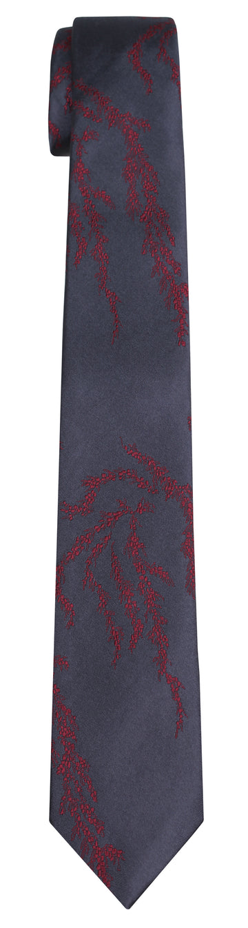 A charcoal silk Mimi Fong tie with dark red seaweed pattern against a white background