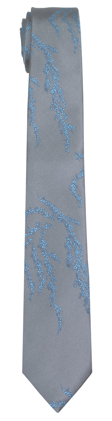 Grey silk Mimi Fong tie with light blue seaweed pattern on a white background