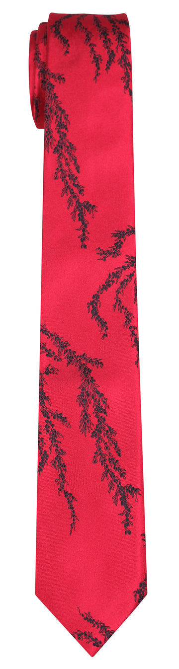 a red Mimi Fong silk tie with black seaweed pattern against a white background