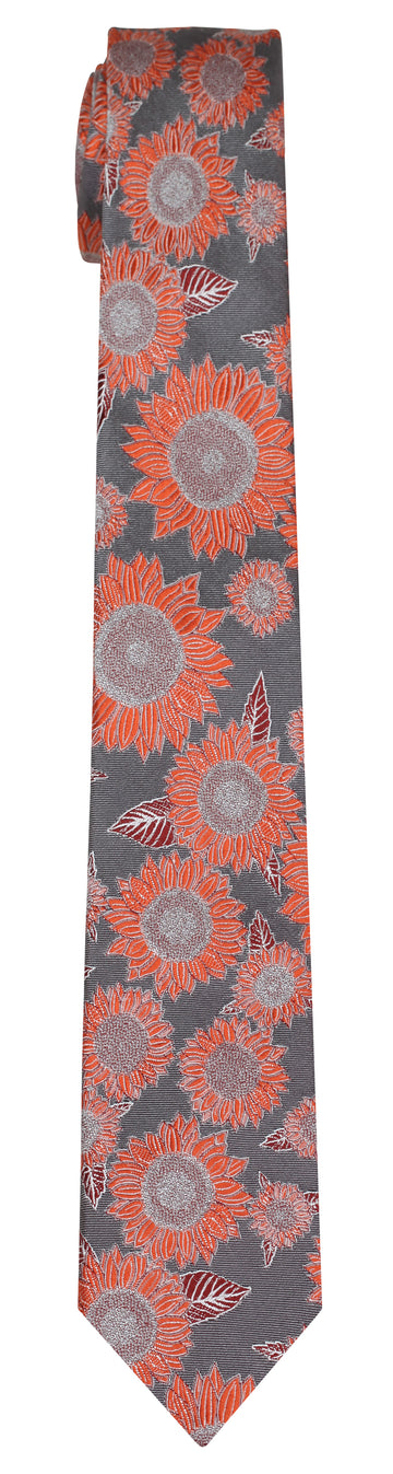 Grey silk Mimi Fong tie with all over sunflower pattern in hues of orange on white background